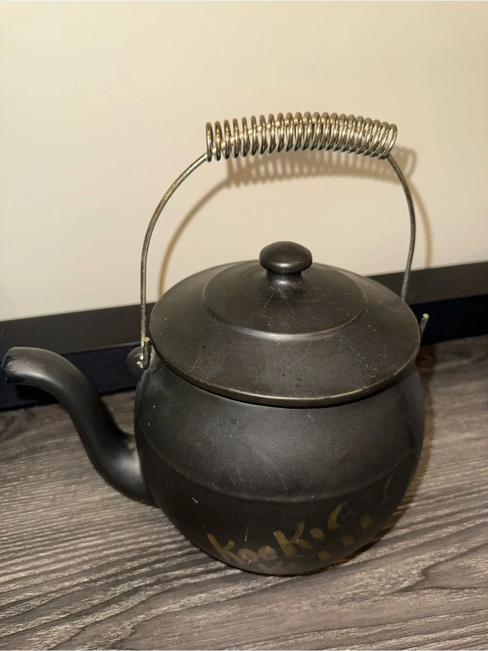 McCoy Pottery Kookie Kettle cookie jar crafted from black ceramic